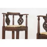 A pair of George II-style carved walnut corner chairs,