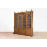 A Victorian Gothic-style golden oak library bookcase,