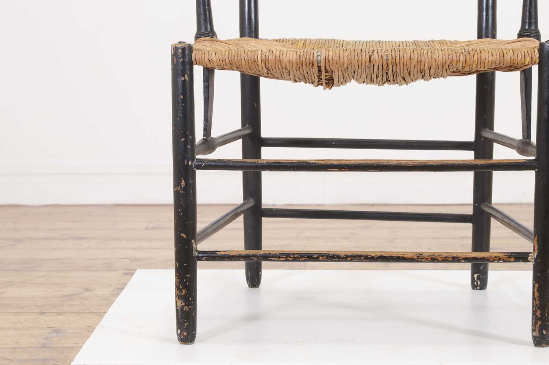 An ebonised wooden elbow chair, - Bild 6 aus 20