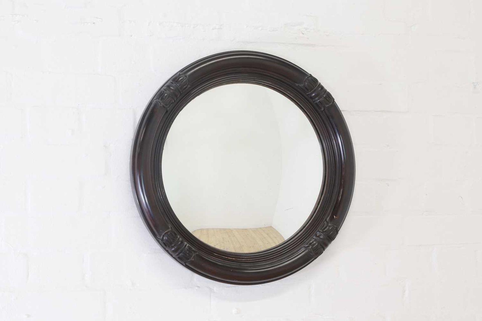 A William IV-style convex mirror,