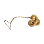 A Victorian Etruscan Revival style knot brooch,