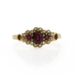 An 18ct gold ruby and diamond cluster ring,