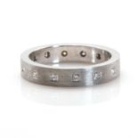 An 18ct white gold diamond set flat section band ring,