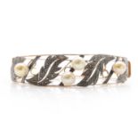 A rose gold, white metal and freshwater pearl hinged bangle,