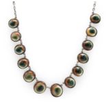 A silver operculum necklace,