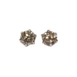 A pair of single stone diamond stud earrings,