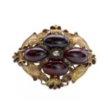 A Victorian foiled garnet and rose cut diamond brooch,