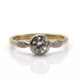 A two colour gold single stone diamond ring,