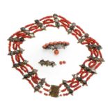 An early 20th century gilt metal four-row banded agate and coral bead necklace,