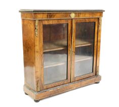 A walnut, ebonised and gilt metal mounted bookcase