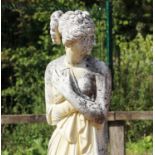 A composite stone garden statue of a classical maiden,