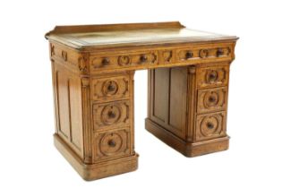 An oak pedestal desk