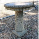 A composite stone bird bath