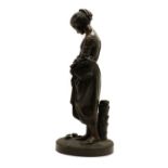 A bronze of a girl feeding pigeons,