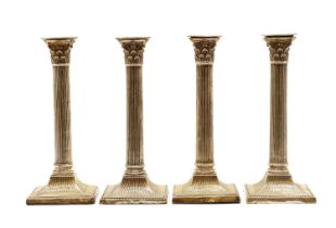 A set of four silver candlesticks