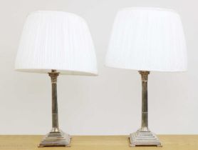 A pair of silver-plated table lamps,