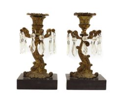 A pair of Regency gilt metal candlesticks