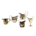 A group of five silver cream jugs