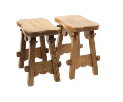 A pair of adzed oak occasional tables