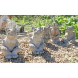 A group of five composite stone gargoyles,