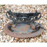 A cast iron boot scraper