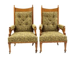 A pair of Arts & Crafts oak armchairs