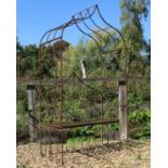 A wrought iron garden arbour seat