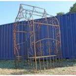 A wrought iron garden conversation seat or arbour seat