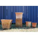 A group of four Italian terracotta garden urns