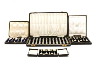 Four cased sets of silver flatware