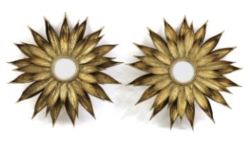 A pair of sunburst mirrors