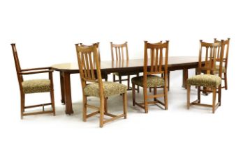 An Arts & Crafts oak wind-out dining table,