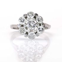 A platinum and diamond flowerhead cluster ring,