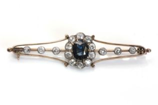 A sapphire and diamond brooch,