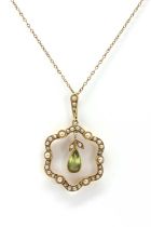 An Edwardian peridot and seed pearl pendant by Murrle Bennett & Co.,