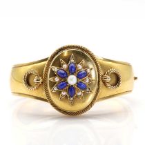 A Victorian gold, lapis lazuli and pearl hinged bangle with double-sided locket,