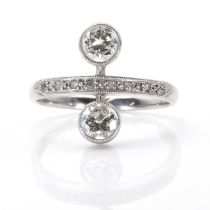 A vertical two stone diamond ring,