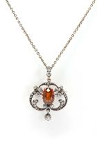 A late Victorian hessonite garnet and diamond pendant/brooch,