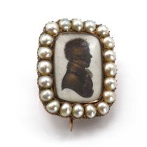 A Georgian bronzed silhouette and pearl lace pin,