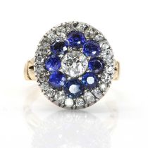 An early 20th century diamond and sapphire target cluster ring,
