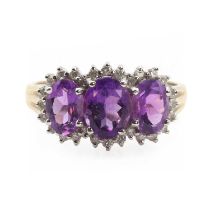 A 9ct gold amethyst triple cluster ring,