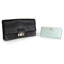 A Kate Spade black leather clutch,