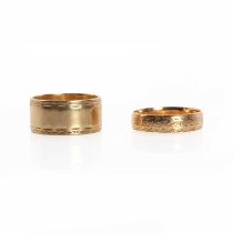 Two gold wedding rings,