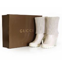 A pair of Gucci cream leather boots,