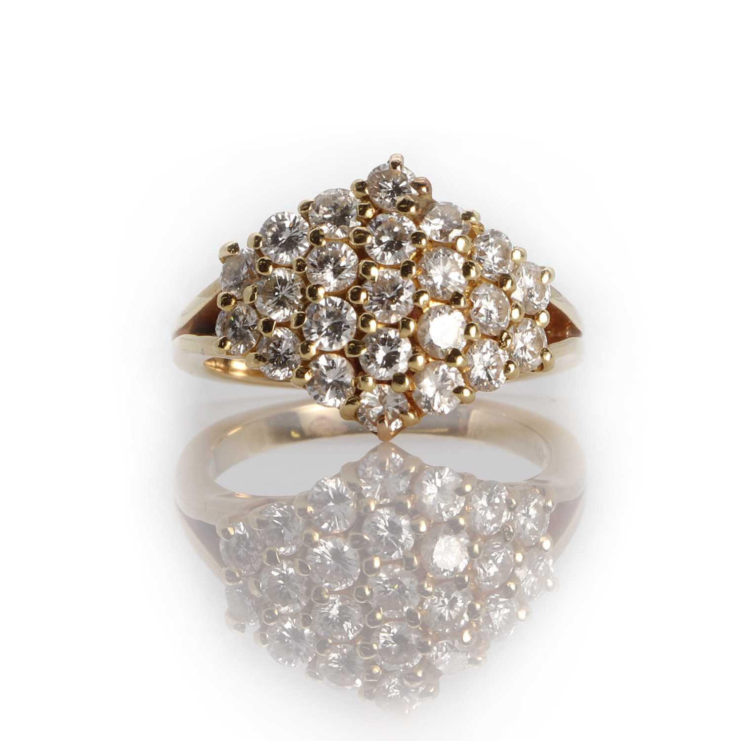 A lozenge shaped diamond panel ring,