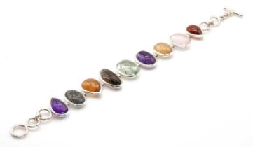 A silver vari-colour gem set bracelet,
