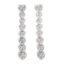 A pair of white gold articulated heart diamond drop earrings