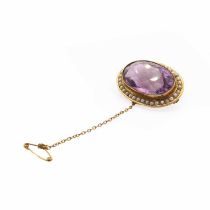 An Edwardian amethyst and split pearl brooch,