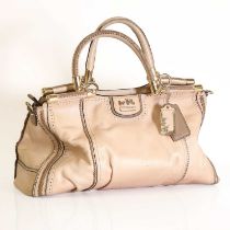 A Coach beige handbag,