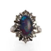 A white gold opal triplet and diamond cluster ring,